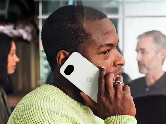 A man using his Android phone on a call. 