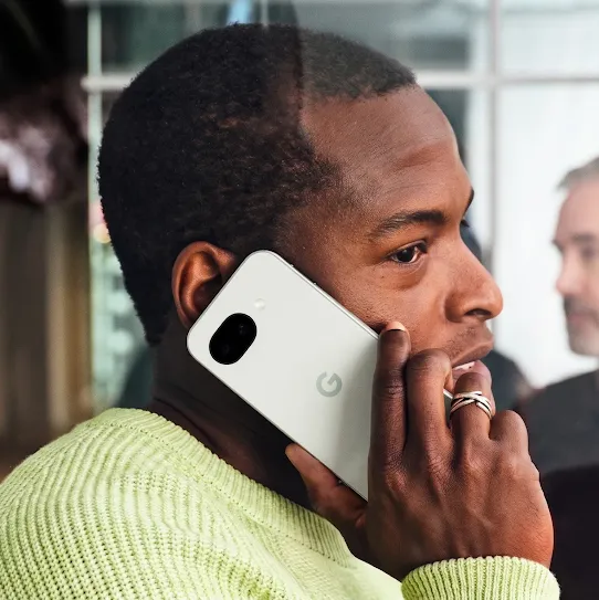 A man using his Android phone on a call. 