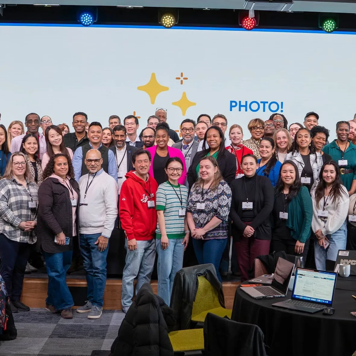 3 rows of teachers posing as a group at the NYCPS AI Literacy event