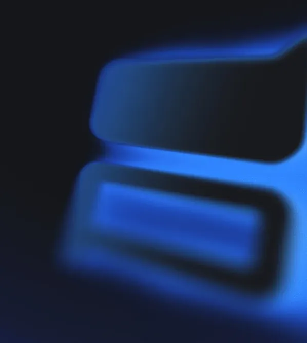Abstract shapes with soft neon-blue light against a dark background.