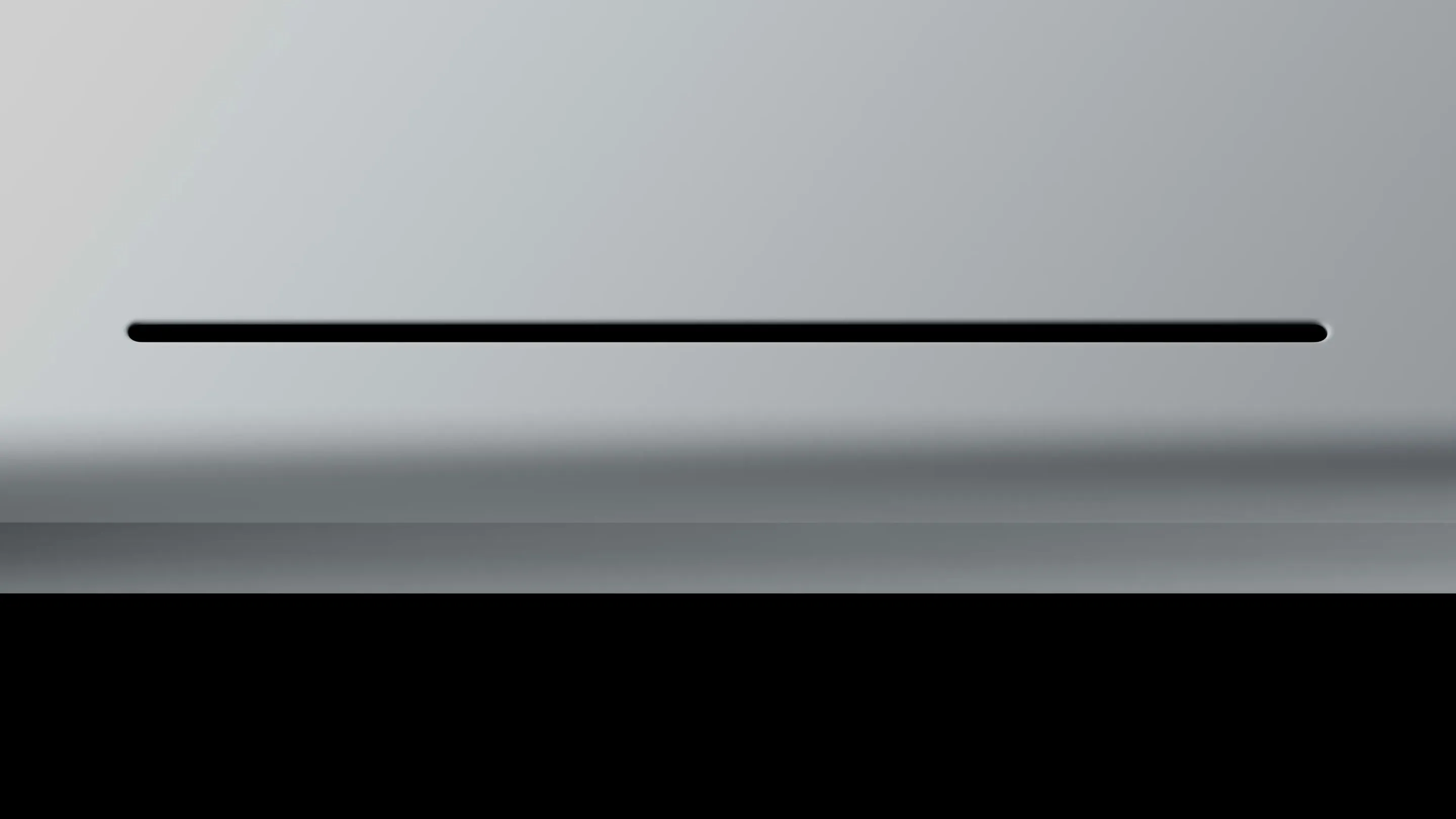 Close-up of the Googlebook glowbar lighting up as the device powers on.