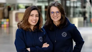 Two women posing for a picture.