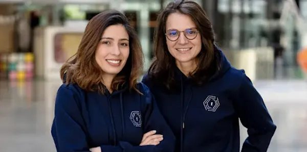 Two women posing for a picture.