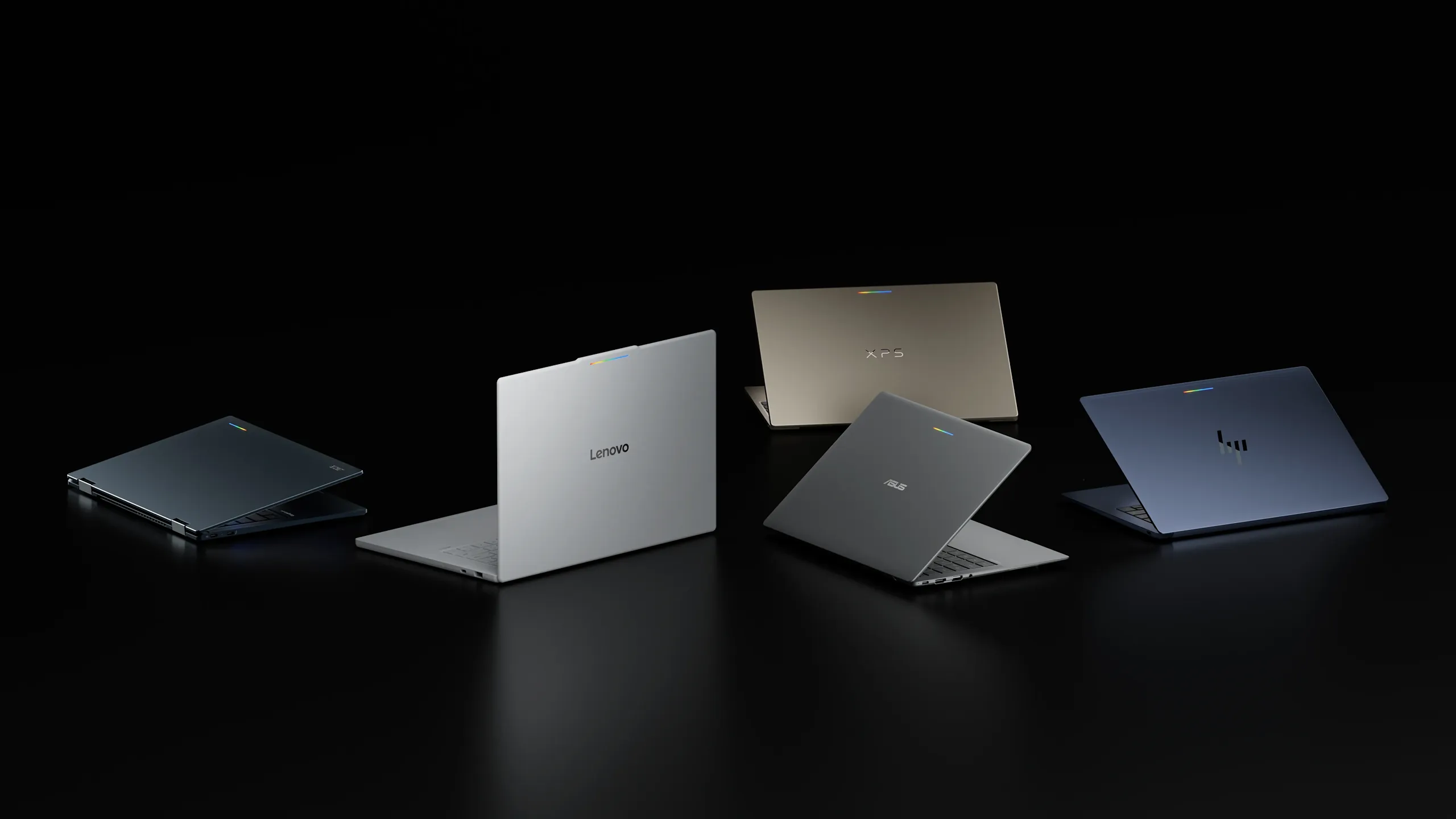 Several Googlebook laptops displayed together.