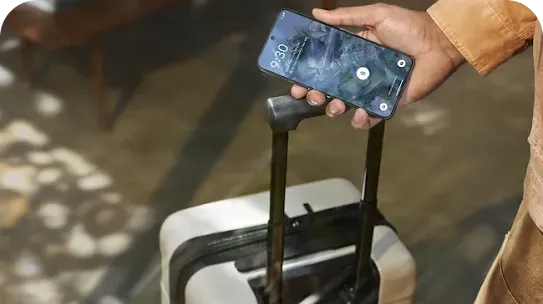 Travelling man holding his Android phone