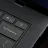 Close-up of the Googlebook keyboard corner showing the power button, volume keys, backspace key, and speakers.