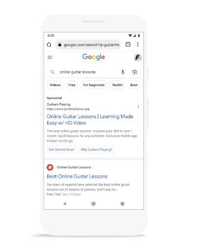 A mobile Google Search results page for "online guitar lessons" featuring a prominent "Sponsored" ad for "Guitars Playing" with links for "Learning Made Easy" and "HD Video."