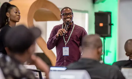 A person hosting an event while mice in his hand.