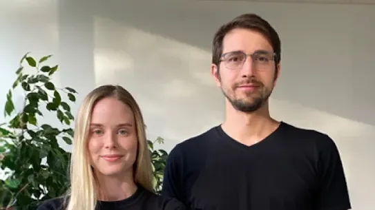A man and a woman looking at camera.