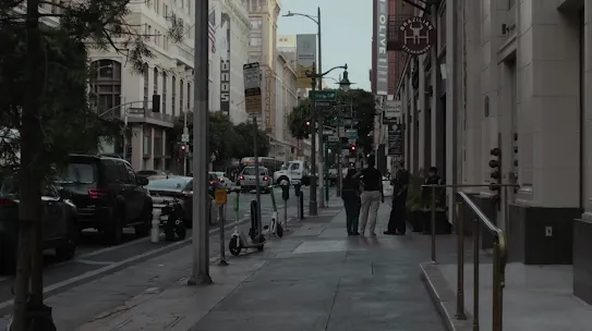 A view of a city street with an overlay that displays information for a business called ‘Serendipity Cards’, showing a 4.3 star rating and is a 5-min walk away. Another overlay appears with directions. 