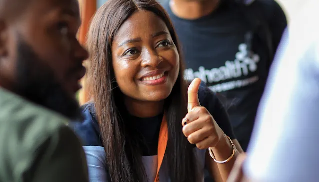 A woman giving a thumbs-up