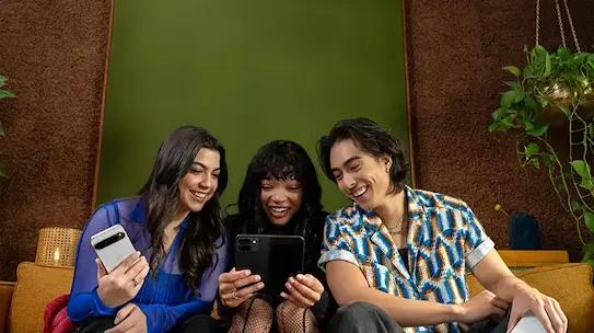 People sitting together holding their Android devices