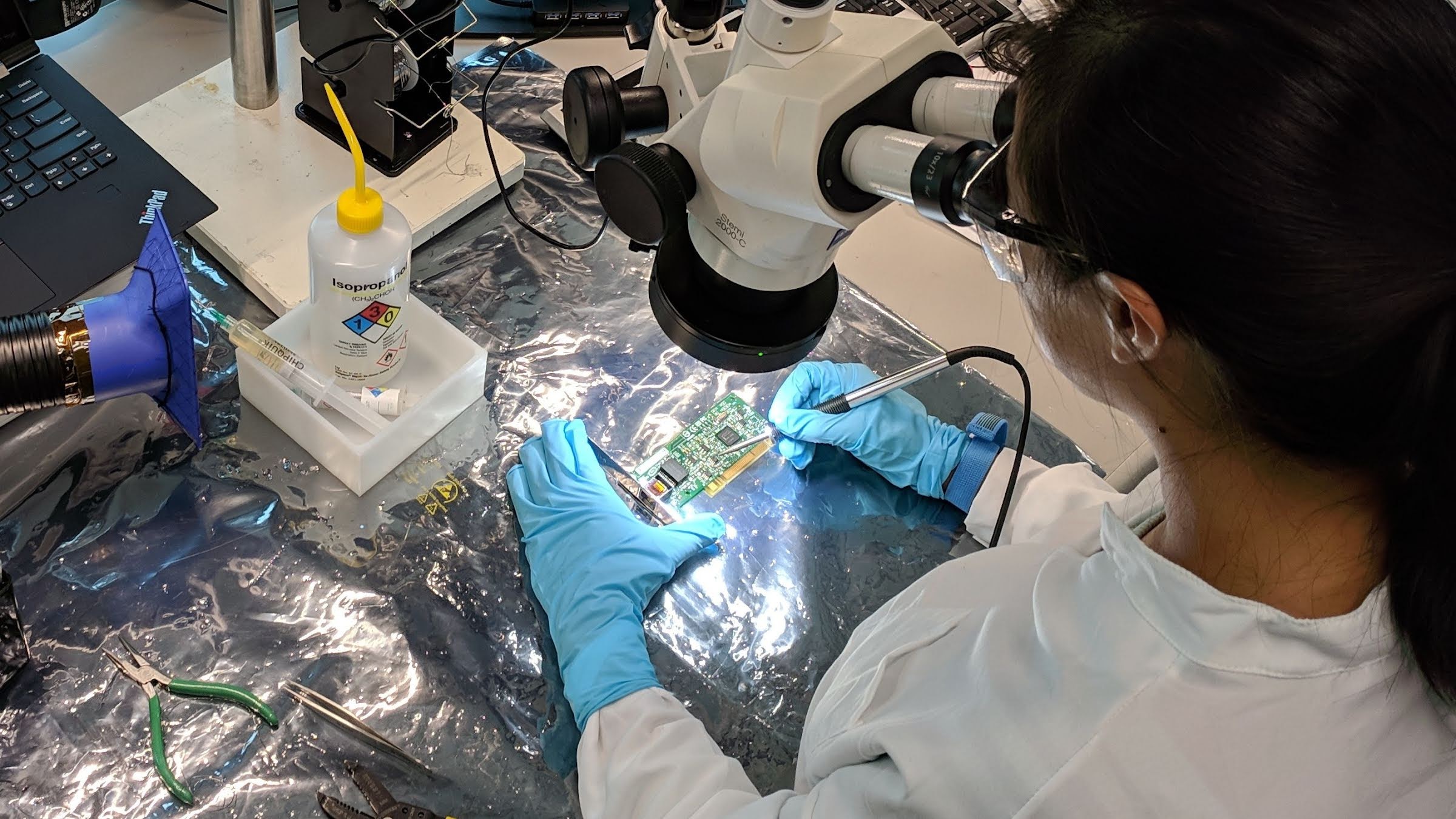 A worker builds a consumer hardware product.