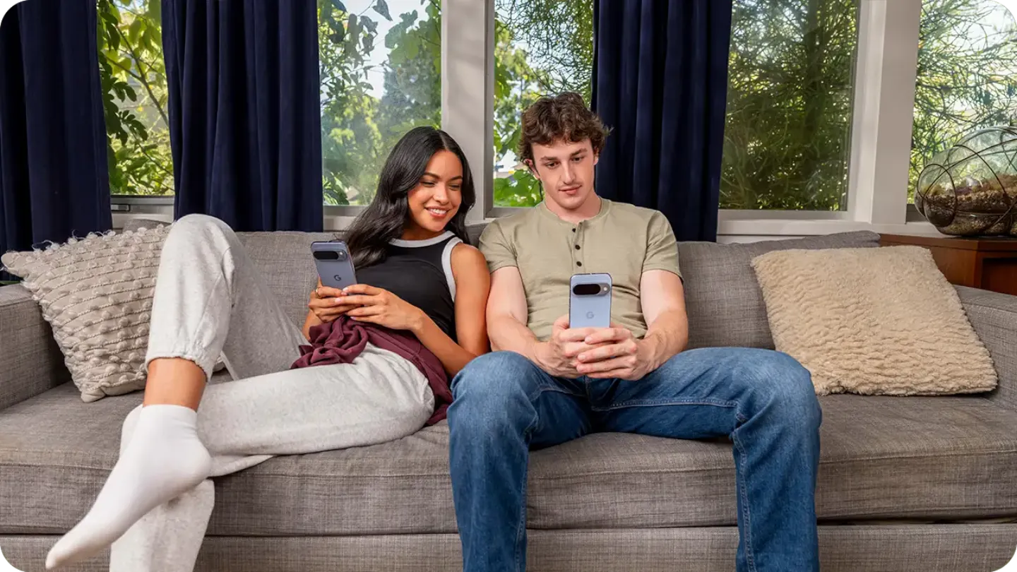 Couple sharing files using Android devices.