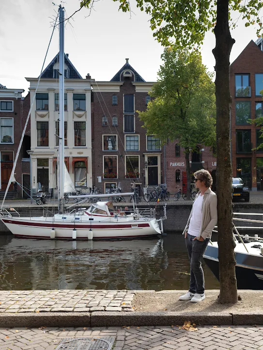 Googler Marco Ynema stands near a canal with boats floating by in Eemshaven, Netherlands