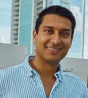 A photograph of Jayger McGough Tomasino, the co-owner of The Prime Cleaner, a cleaning company based in Miami, Florida.