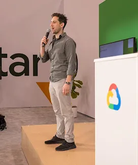 Holding a microphone, the host is managing the event.