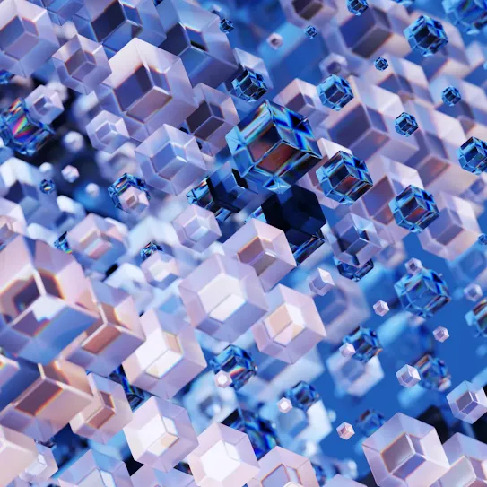 An abstract 3D render of floating, translucent blue and white crystal cubes with iridescent edges against a soft blue background, representing data or technology.