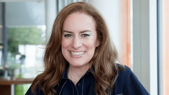 A professional headshot of Debbie Weinstein, Vice President of Google UK and Ireland, smiling in a bright office setting with large windows in the background.