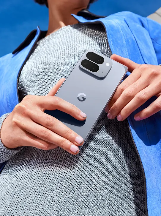 A Moonstone Google Pixel 10 Pro phone grouped together with the Google Pixel Buds Pro 2 and Google Pixel Watch 4.