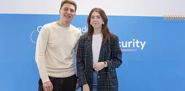 A man and woman posing for picture.