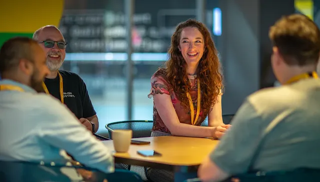 People seated at a table, enjoying a meaningful discussion.