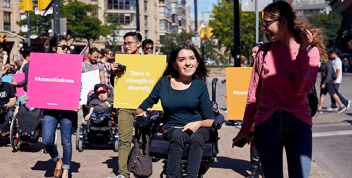 The image was taken in downtown Toronto during a MapMission for AccessNow. A Mapmission is an event where people come together to map a certain area of a city or neighbourhood on the AccessNow platform. In the photo you have accessnow staff and community members.