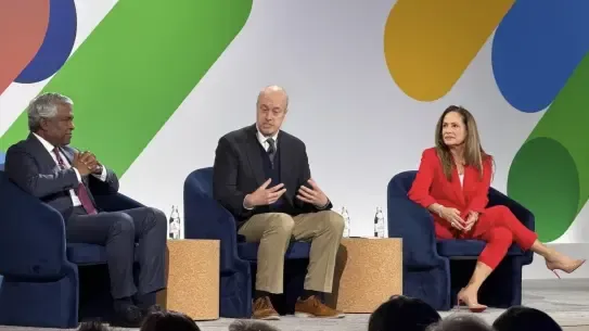 three professionals sit on stage at the Google Public Sector Summit 2025