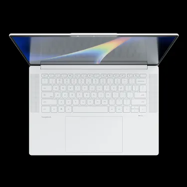 Googlebook laptop open, viewed from above, showing the keyboard and rainbow-gradient display.