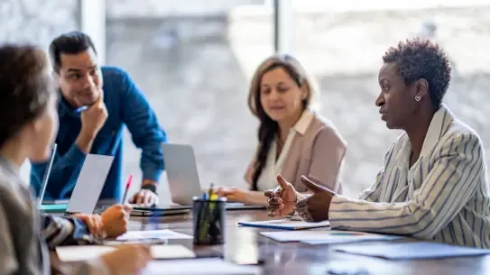 Team discussion around an office table