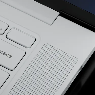 Close-up of the Googlebook keyboard corner showing the power button, volume keys, backspace key, and speakers.
