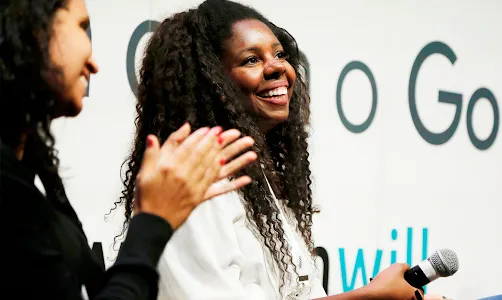 A woman holding a mic.