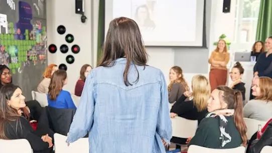 A woman addressing to the group