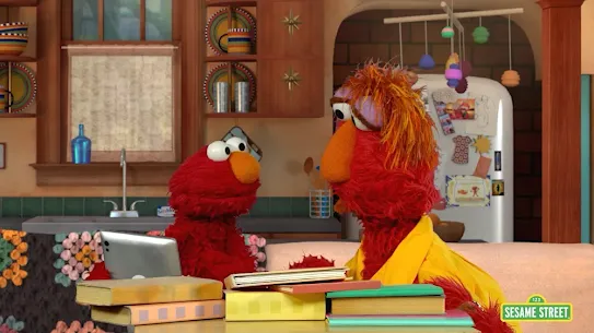 Sesame street image of elmo and other red muppet 