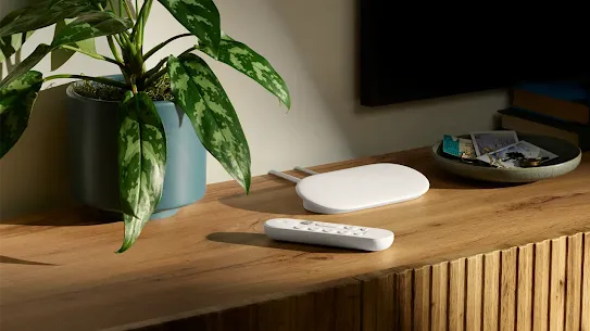 Image of a Google TV Streamer (4K) placed on a TV stand