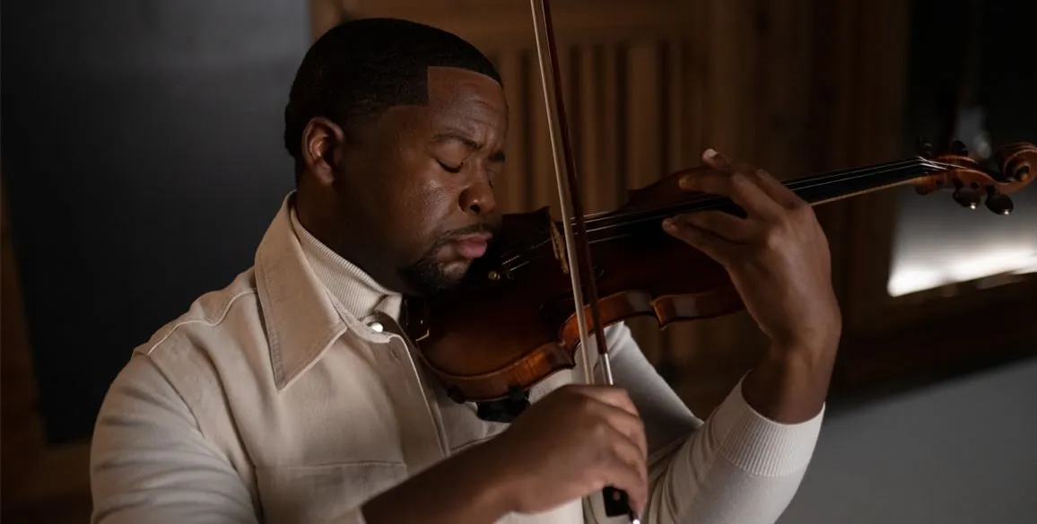 A man playing the Violin