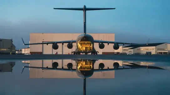 interior of military aircraft shown by hangar with reflection
