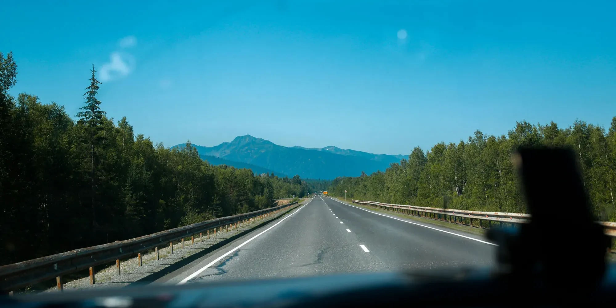Driver using waze navigation app displaying open highway driving directions and fastest route