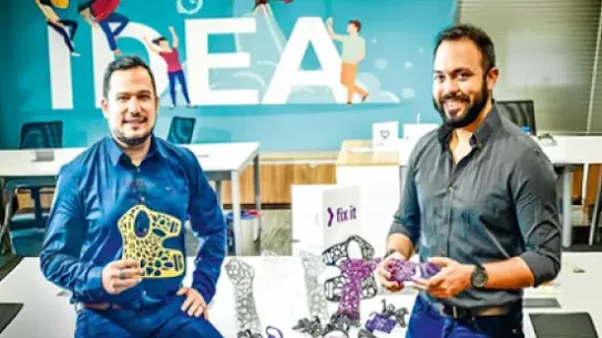 FixIt founders Felipe Neves and Hebert Costa with FixIt prosthetics