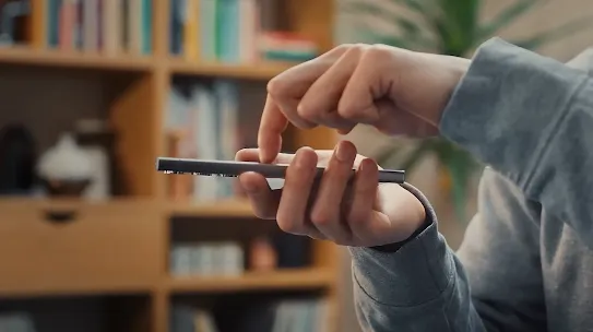A hand tapping a phone screen