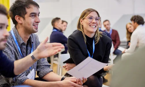 A man and woman looking at something