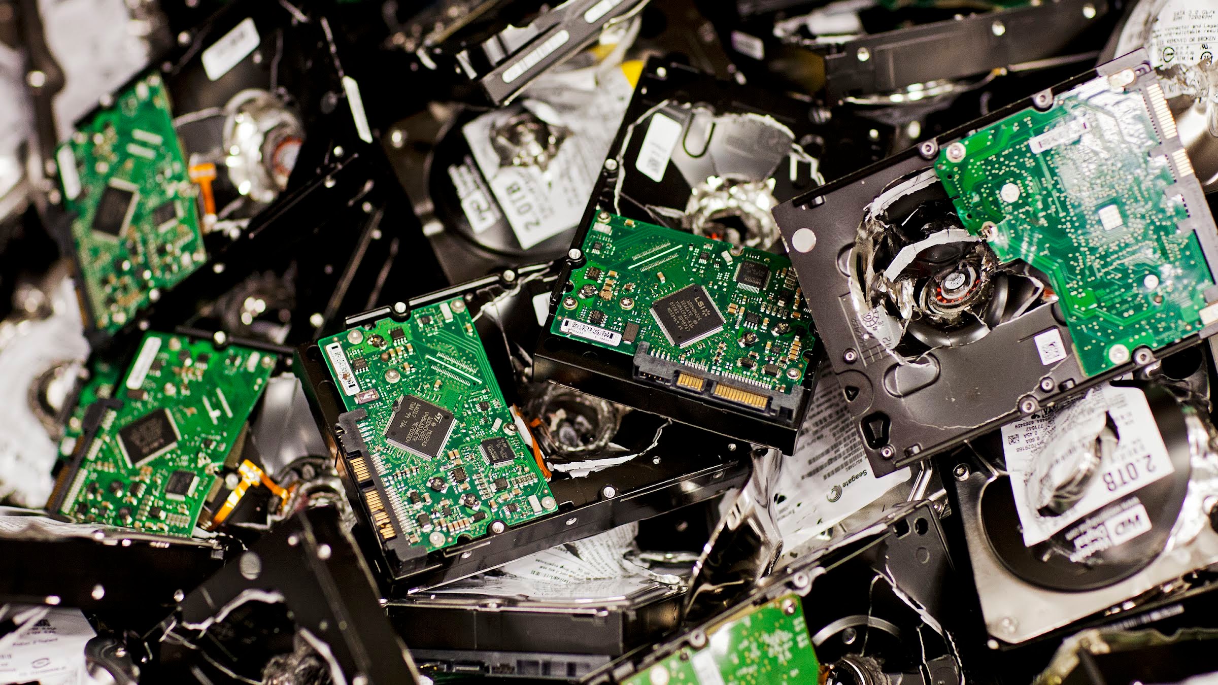 Closeup of many small circuit boards in a pile.