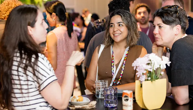 Attendees talking and networking at an event
