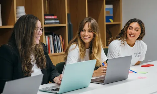 Three women discussing something.
