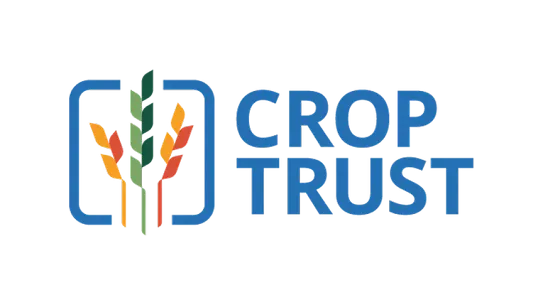 Official Crop Trust logo featuring colorful stylized wheat ears in yellow, green, and orange framed by a blue bracket next to bold blue text on a white background.