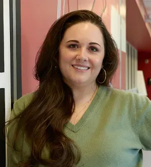 A photograph of Caitlin T., a high school teacher based in Atlanta, Georgia, who completed Google’s AI training.