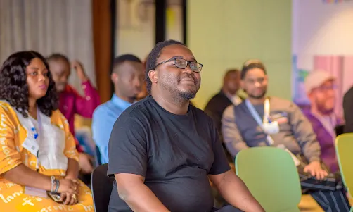 Attendees listening to a presentation at a professional workshop.