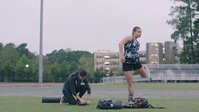 Founders Ivonna Dumanyan and Gabrielle Levac are sitting side by side at a desk during a meeting smiling.