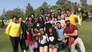 The Zyla team pose in daylight at a park.