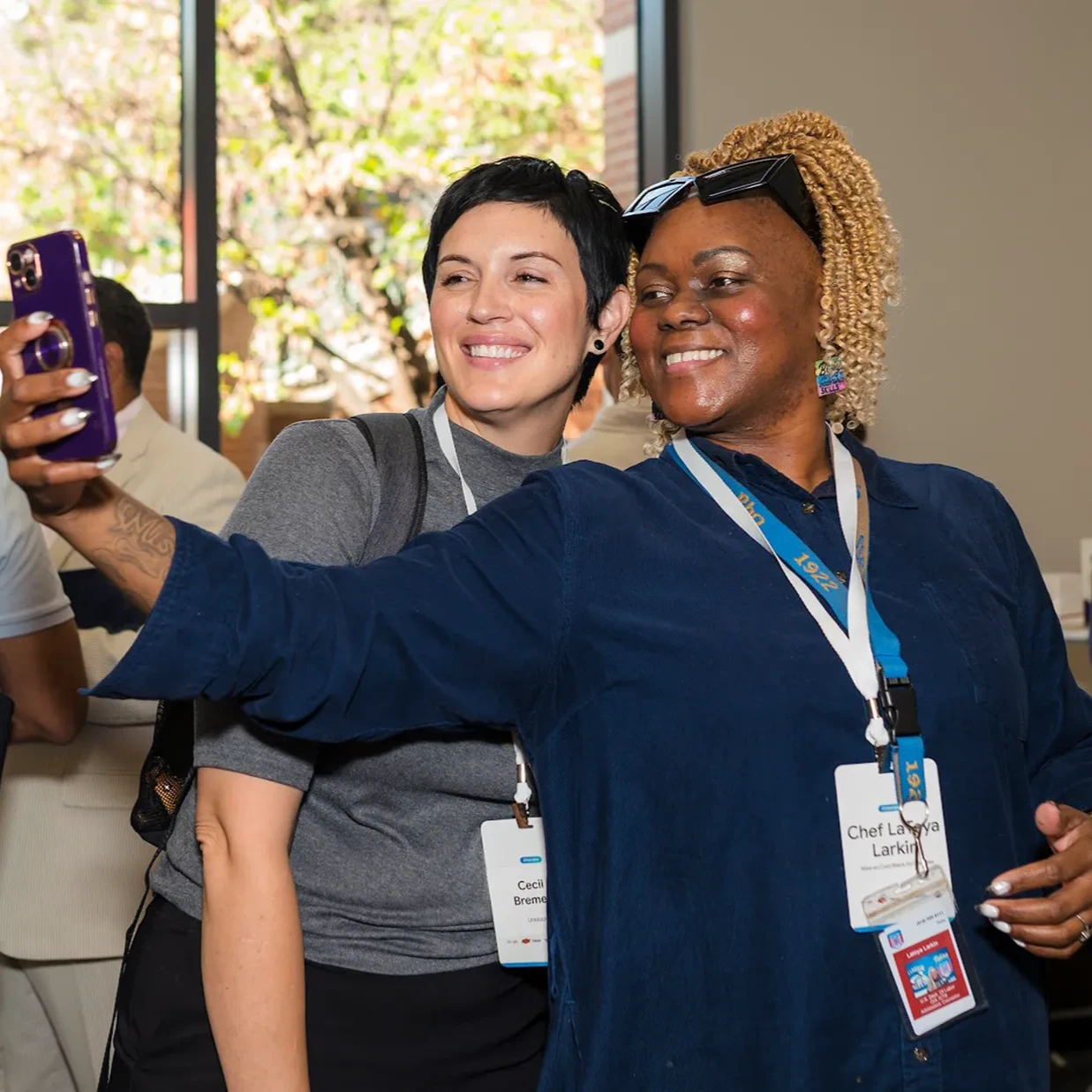Two people at a workshop taking a selfie together